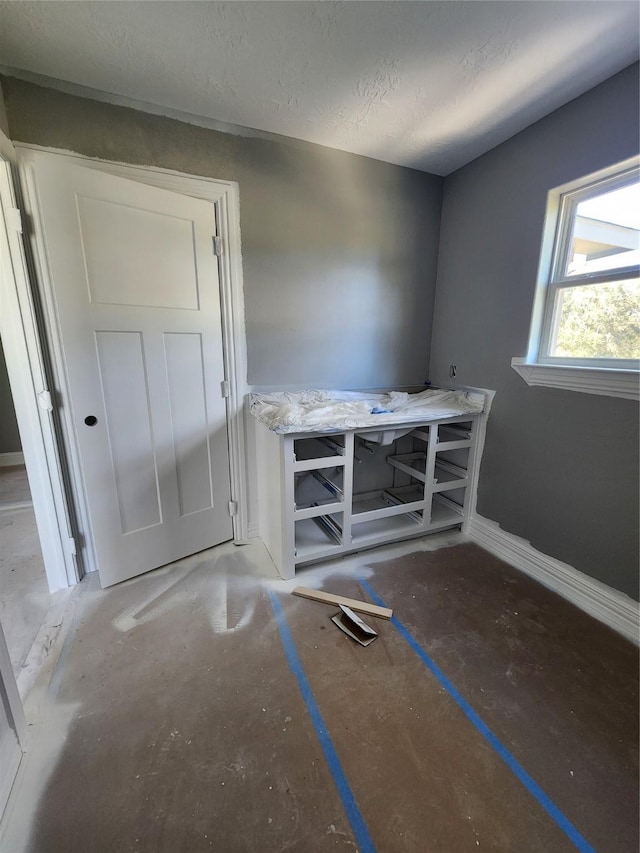 interior space with a textured ceiling