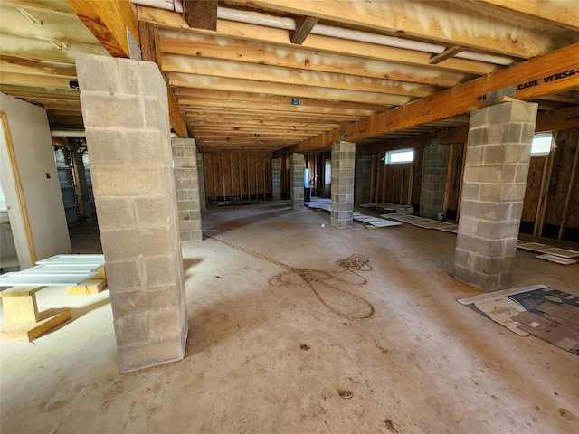 interior space featuring unfinished concrete flooring