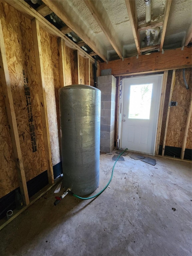 utility room with water heater