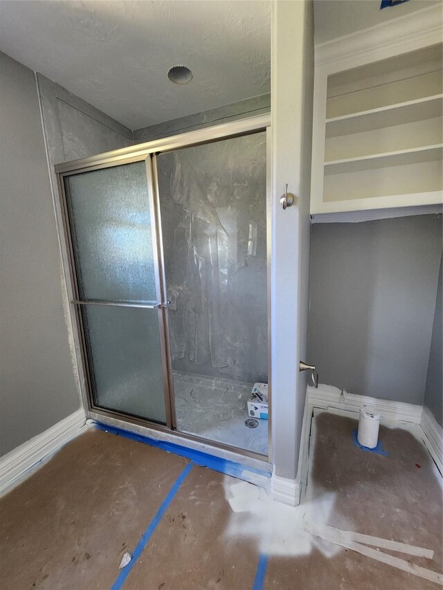 bathroom with a shower stall