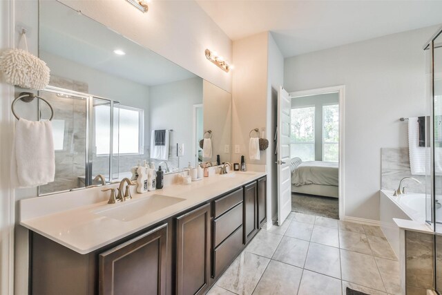 bathroom with dual vanity, shower with separate bathtub, and tile patterned floors