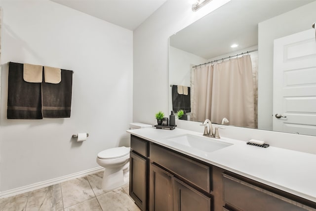 bathroom featuring vanity, toilet, and tile patterned flooring