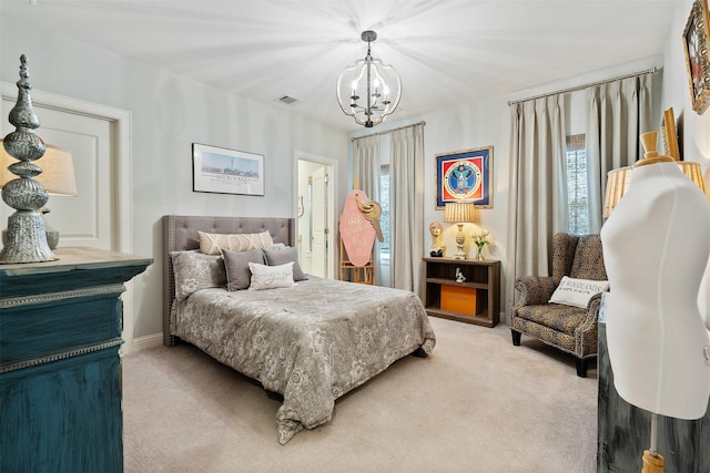 carpeted bedroom featuring a notable chandelier