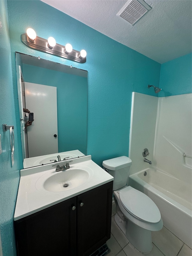 full bathroom with tile patterned flooring, shower / washtub combination, a textured ceiling, toilet, and vanity