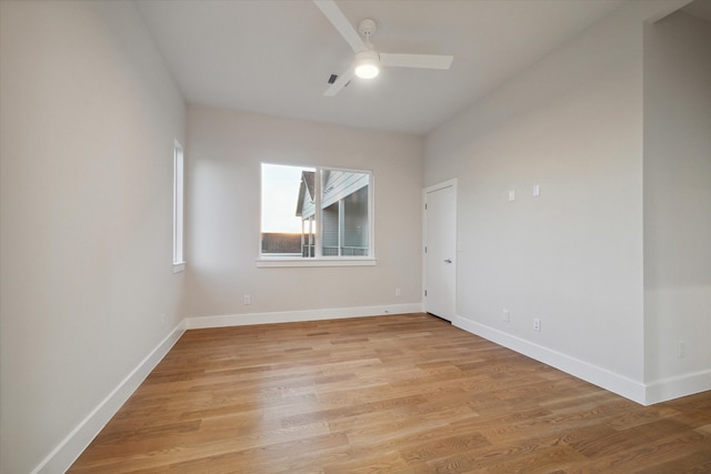 unfurnished room with ceiling fan and light wood-type flooring