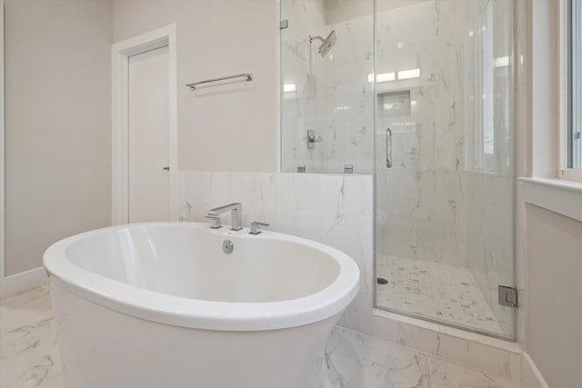 bathroom with independent shower and bath, tile patterned flooring, and tile walls