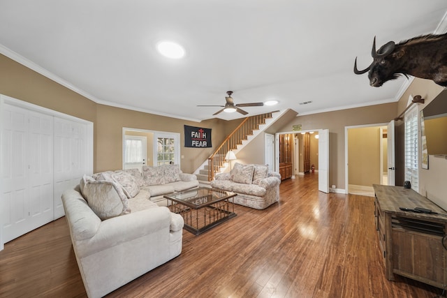 living room with ceiling fan, crown molding, and hardwood / wood-style flooring