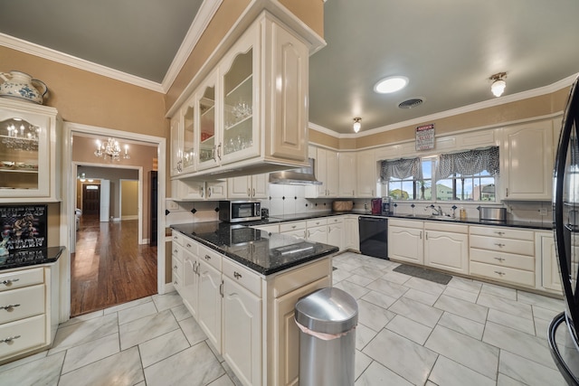 kitchen with black appliances, crown molding, backsplash, dark stone counters, and light hardwood / wood-style flooring