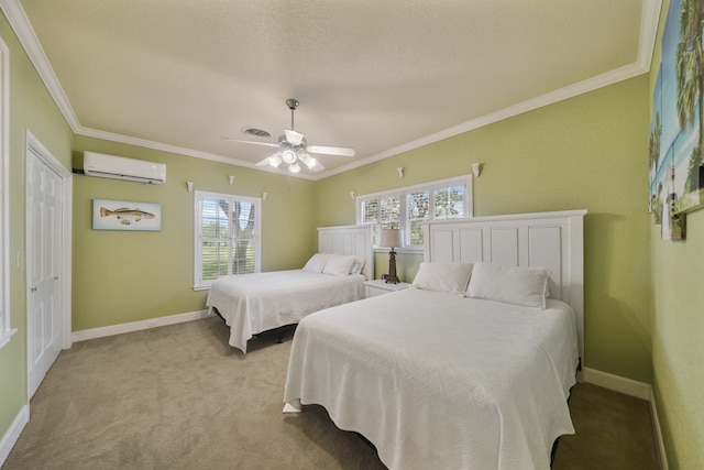 carpeted bedroom with an AC wall unit, ceiling fan, crown molding, and a closet