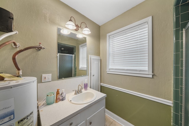 bathroom with vanity, electric water heater, and tile patterned flooring