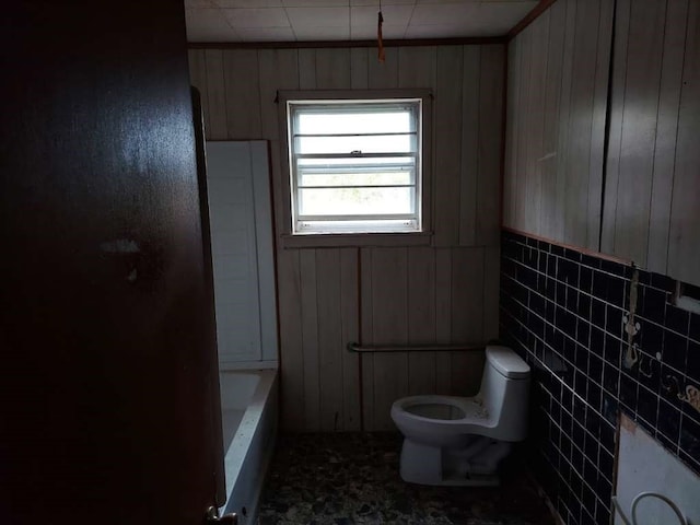 bathroom with toilet and tile patterned floors