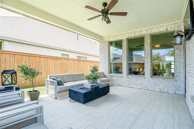 view of patio featuring outdoor lounge area and ceiling fan