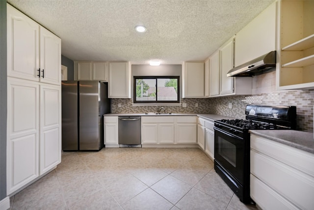 kitchen with white cabinetry, sink, backsplash, light tile patterned floors, and stainless steel appliances