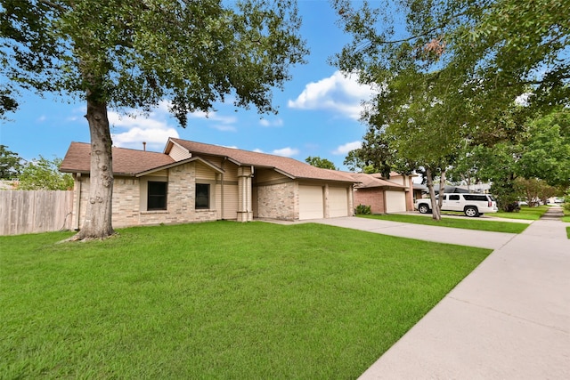 single story home featuring a garage and a front yard