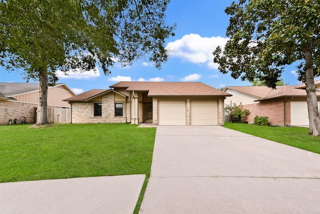 ranch-style house featuring a garage and a front lawn