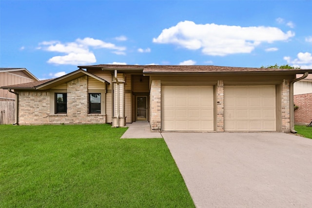 view of front facade with a garage and a front yard