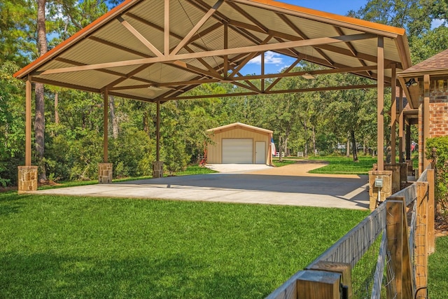 view of yard with an outdoor structure and a garage