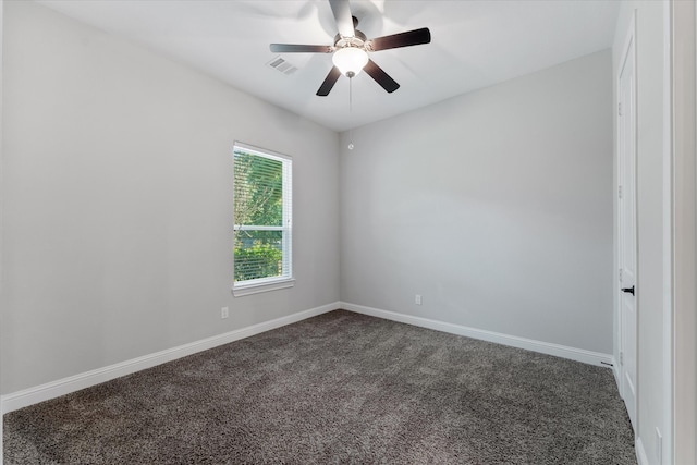 spare room featuring ceiling fan and carpet flooring