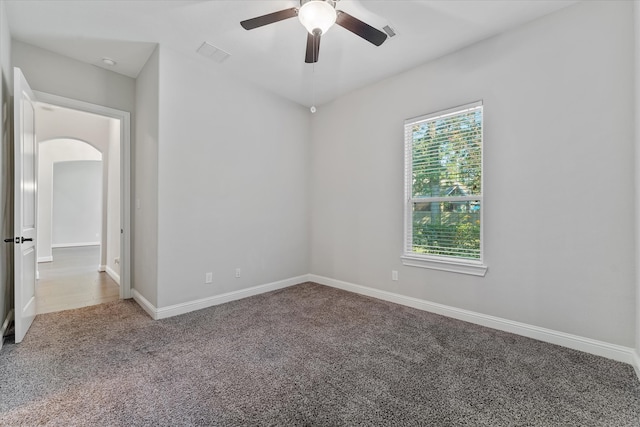 unfurnished room featuring carpet and ceiling fan