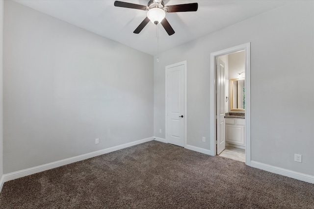 unfurnished bedroom with connected bathroom, light carpet, ceiling fan, and a closet