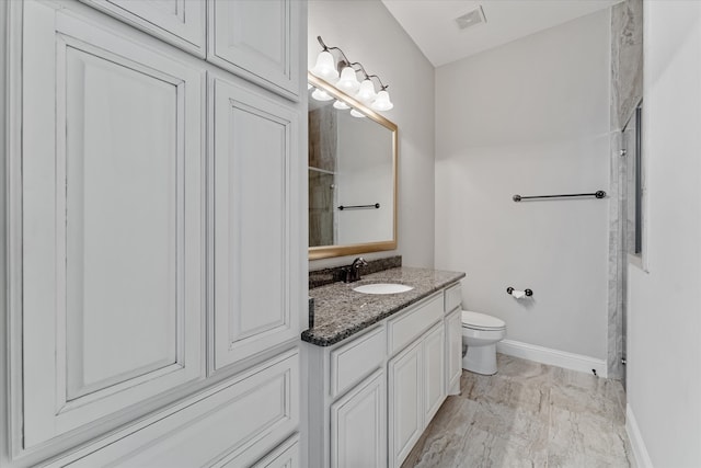 bathroom with hardwood / wood-style floors, walk in shower, vanity, and toilet