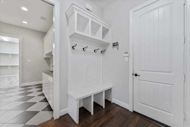 mudroom with dark hardwood / wood-style floors