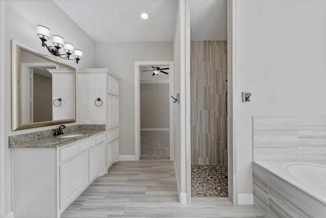 bathroom with shower with separate bathtub, vanity, and ceiling fan