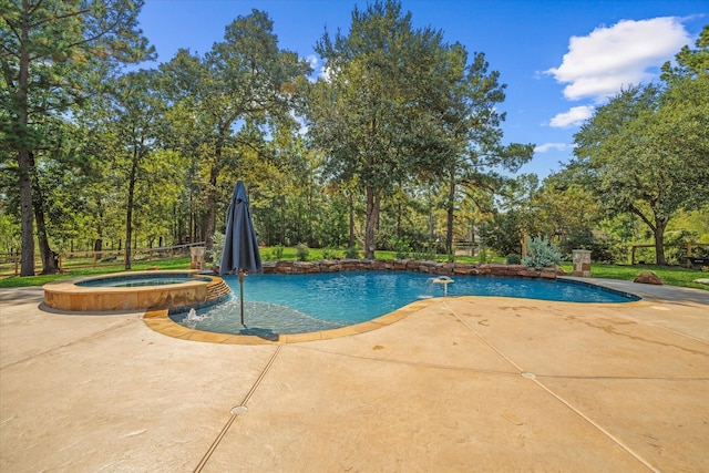 view of swimming pool with pool water feature, an in ground hot tub, and a patio area