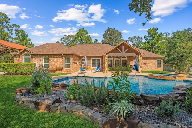 view of swimming pool featuring a patio and an in ground hot tub