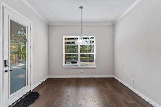 unfurnished dining area featuring an inviting chandelier, dark hardwood / wood-style floors, and crown molding