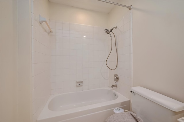 bathroom featuring  shower combination and toilet