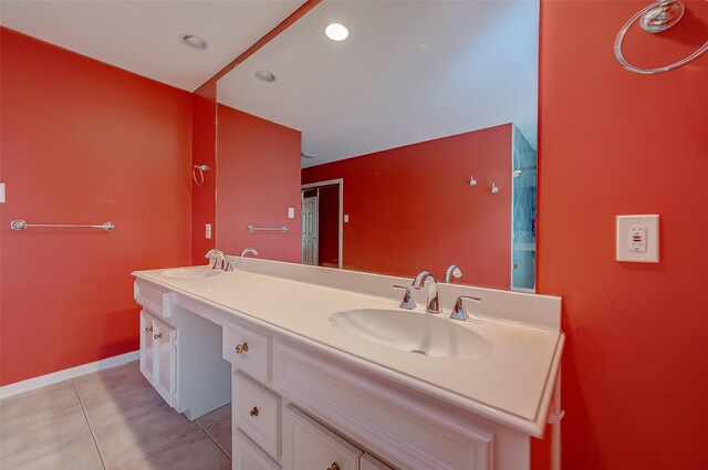 bathroom with tile patterned flooring and dual vanity