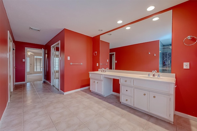 bathroom featuring tile patterned floors, visible vents, a sink, and double vanity