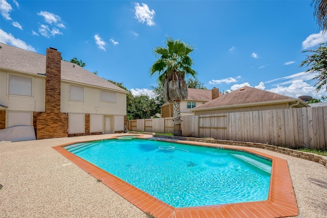 view of swimming pool featuring a fenced backyard and a fenced in pool