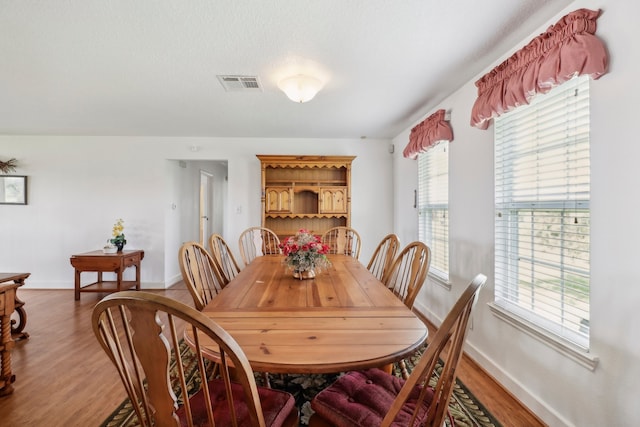 dining space featuring hardwood / wood-style flooring