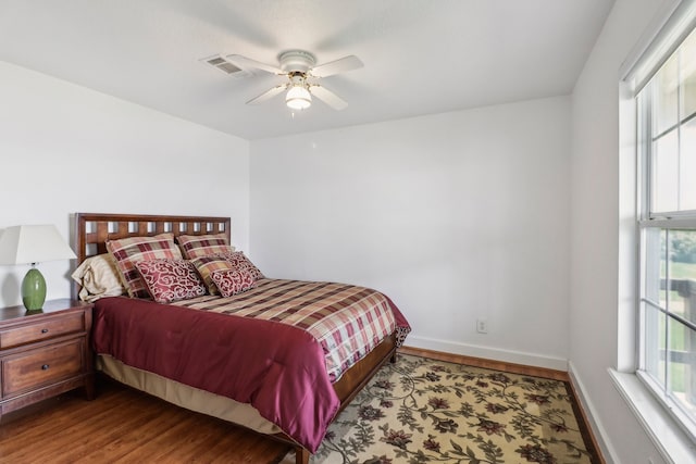 bedroom featuring ceiling fan and wood-type flooring