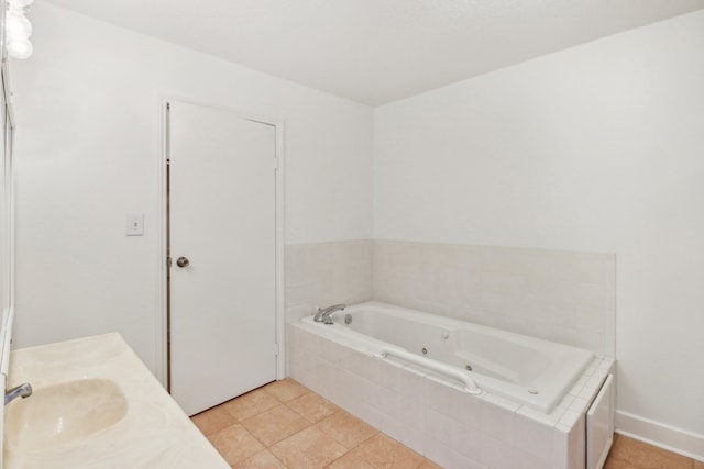 bathroom with vanity, tiled bath, and tile patterned floors