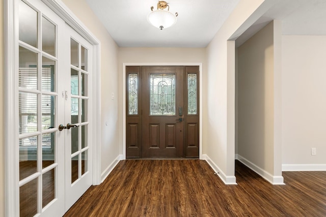 foyer entrance featuring french doors, plenty of natural light, dark wood finished floors, and baseboards