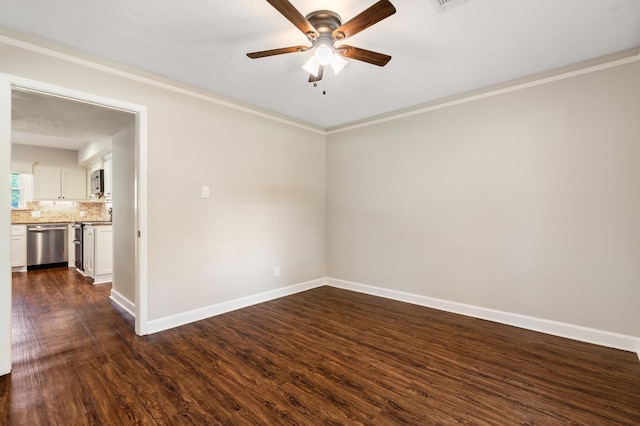 unfurnished room with baseboards, ceiling fan, dark wood-style flooring, and crown molding