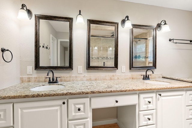 full bath featuring a sink and double vanity