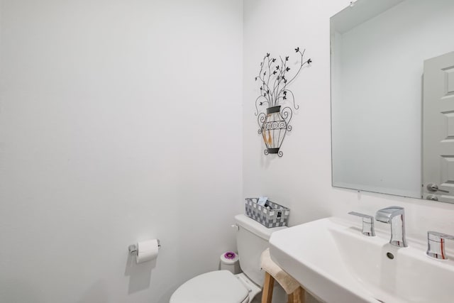 bathroom with sink and toilet