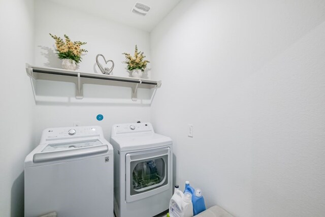 laundry area featuring washing machine and dryer