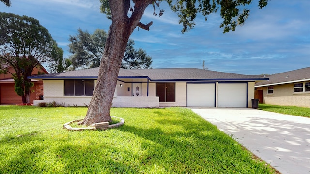 ranch-style house with a front lawn and a garage