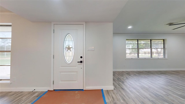 foyer entrance featuring ceiling fan and light hardwood / wood-style floors