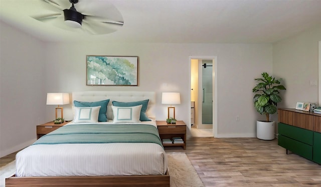 bedroom with hardwood / wood-style floors and ceiling fan