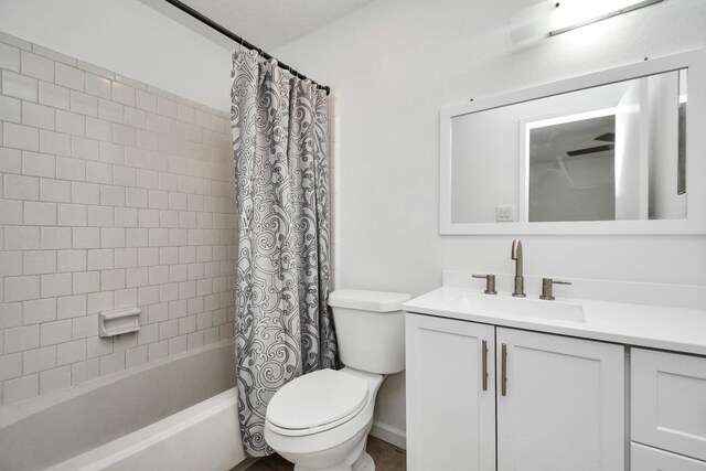 full bathroom featuring toilet, vanity, and shower / tub combo with curtain