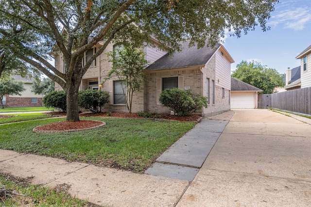 view of front of property featuring a garage and a front yard