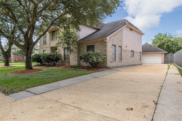 view of front facade with a garage and a front lawn