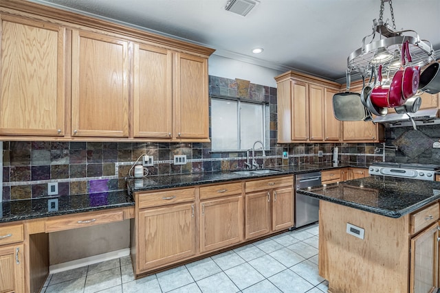 kitchen featuring tasteful backsplash, dark stone counters, appliances with stainless steel finishes, light tile patterned floors, and sink