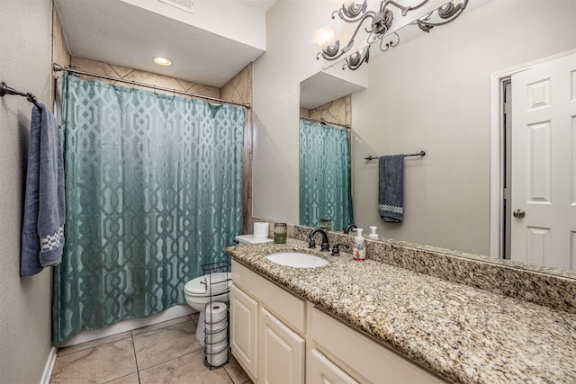 bathroom featuring tile patterned flooring, vanity, toilet, and a notable chandelier